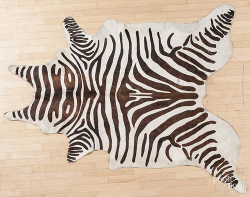 Faux zebra cow hide rug, approx. 6' 10'' x 4' 9''.