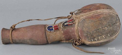 African water bottle with applied beads, 20th c., 19'' h.