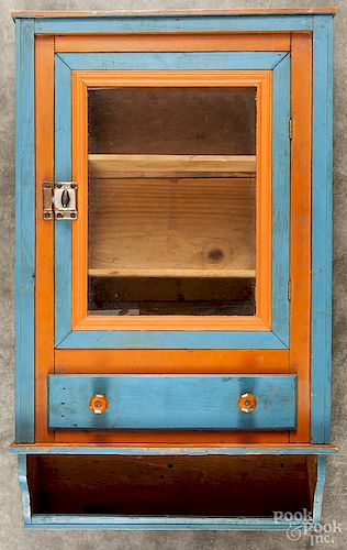Painted pine hanging cupboard, 19th c., retaining its original salmon and blue surface
