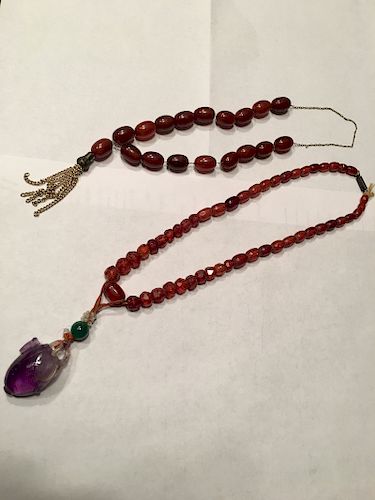OLD Chinese Blood Amber neckalces, one with toumaline pendant 