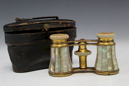Antique mother of pearl opera glasses in original leather box.