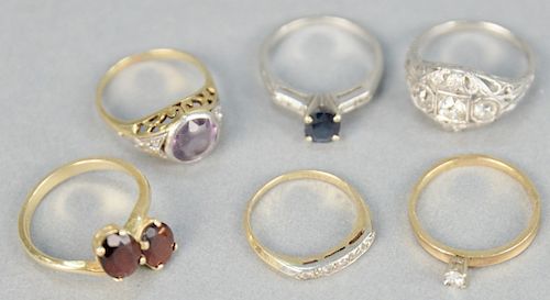 Six rings with stones, one platinum with diamonds, one platinum with blue stone. 3 being 14K gold, 15.8 total grams.