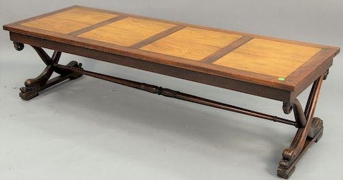 Baker Rosewood and pecan coffee table, having curule dolphin base, ht. 16 in., top: 21" x 60".