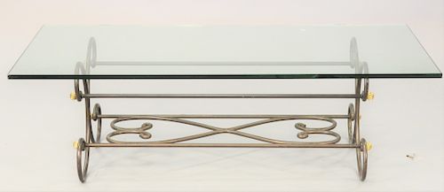 Glass top coffee table, with iron and brass trimmed base, ht. 18 1/4 in., top 30 x 60 in.,