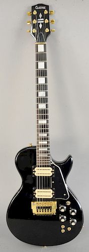 Carvin electric guitar, having a black body and six strings, in fitted case, pre 1970.