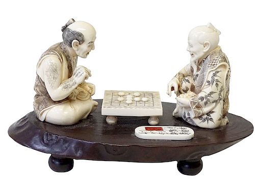 A Japanese Export Carved Group