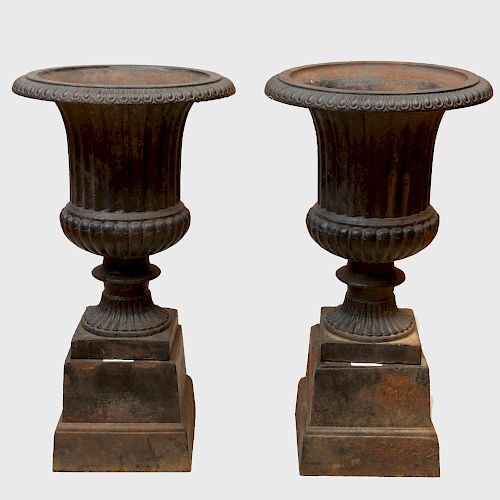 Pair of Black Painted Cast Iron Garden Urns on Bases