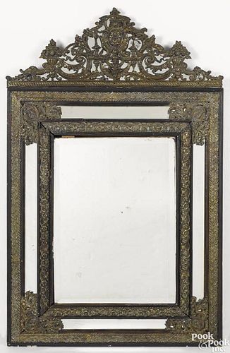 Continental beveled glass mirror with embossed brass surrounds, 19th c., 53'' x 33 1/4''.
