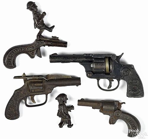 Four cast iron cap guns, 19th/20th c., to include an Ives The Chinese Must Go
