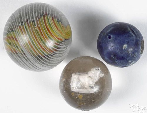 Large swirl marble, 2'' dia., together with a sulfide marble with a lion, 1 1/2'' dia.