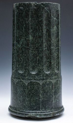 A FLUTED AND ENGRAVED GREEN MARBLE COLUMN FRAGMENT