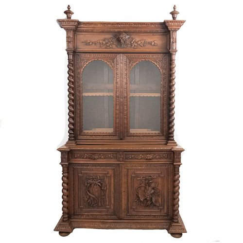 Buffet. France. 20th Century. Henri II. Carved in oak. With 2 drawers and 4 hinged doors. 100 x 54.7 x 24" (255 x 139 x 61 cm.)