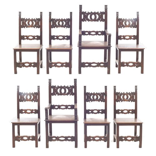 Lot of 2 armchairs and 6 chairs. France. 20th Century. Carved in walnut. Half-closed backrests. Total of Pieces: 8.