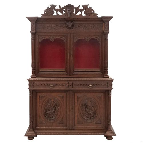 Buffet or Sideboard. France. 20th Century. Henri II. Carved in oak. With 2 drawers, 4 doors, 2 with glass. 86.6 x 58 x 22.4" (220 x 147 x 57 cm)