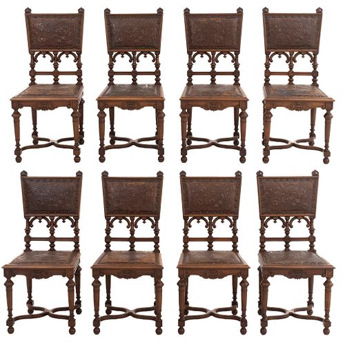 Lot of 8 chairs. France. 20th Century. Henri II. Carved in walnut. Semi-open backrests and faux leather seats.