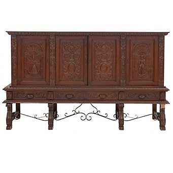 Buffet or Sideboard. France. 20th Century. Spanish Style. Carved in oak. 4 hinged doors and 4 drawers. 58 x 98.4 x 23" (148 x 250 x 59 cm)