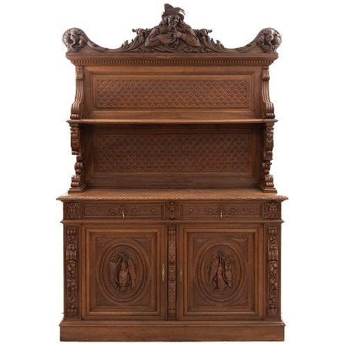 Buffet or Sideboard. France. 20th Century. Henri II. Carved in walnut. With 2 doors, 2 drawers, 2 shelves. 92 x 62 x 25" (234 x 157 x 64 cm)