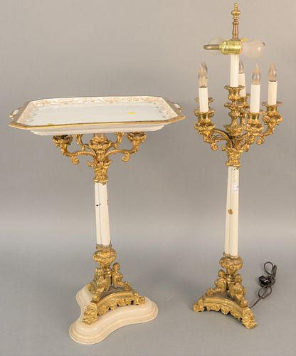 Pair of French bronze candelabras, one made into small table slightly shorter than the other, each resting on triple winged figural base. total ht. 24