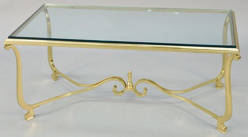 Brass and glass coffee table. ht. 17 in., top: 21" x 41 1/2". Provenance: Estate of William and Teresa Patton, Lake Ave Greenwich, CT