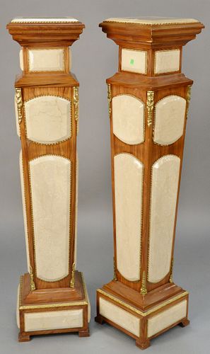 Pair of pedestals with faux marble panels. ht. 54 in.