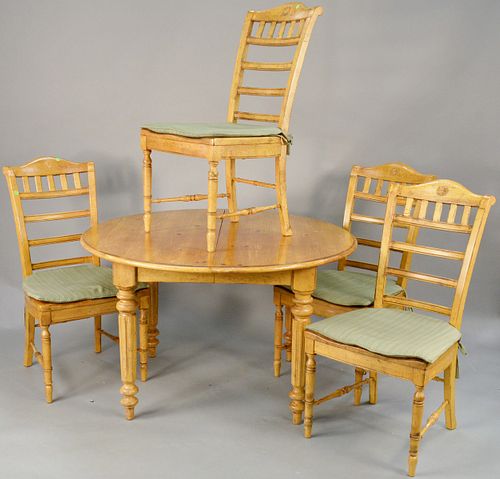Five piece pine round table with four chairs. ht. 29 1/2 in., dia. 50 in. Provenance: Former home of Mel Gibson, Old Mill Rd, Greenwich, CT