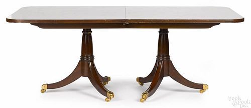 Mahogany pedestal base dining table, 20th c., with two leaves, 30'' h., 120'' w., 44'' d.
