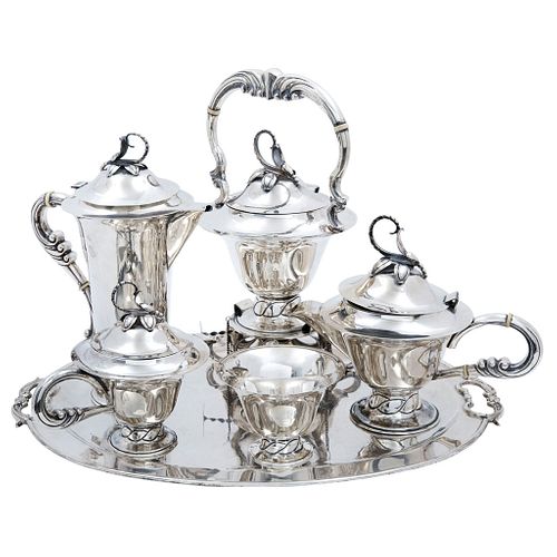Tea and Coffee Set. Mexico. 20th Century. VILLA Sterling Silver 0.925. Design with chiseled handles and vegetable motif.