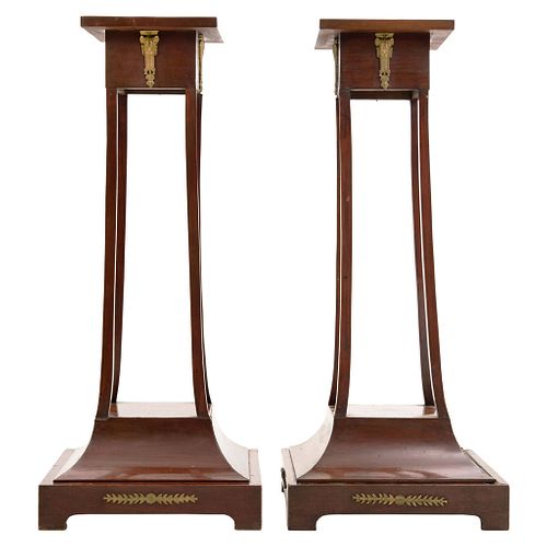 Pair of Pedestals. 20th Century. EMPIRE Style. Carved wood with metal applications.