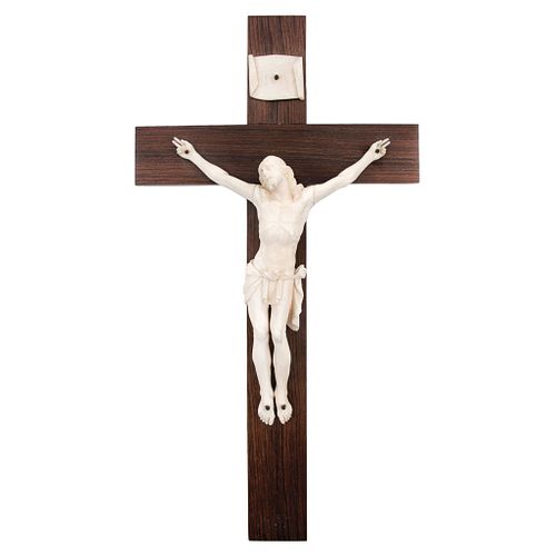 Crucifix. France. 19th Century. Carved in ivory, wooden cross. 16.3 x 8.4" (41.5 x 21.5 cm).