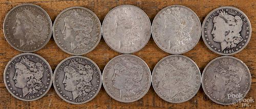 Ten Morgan silver dollars of various dates and grades, 1884-1902.