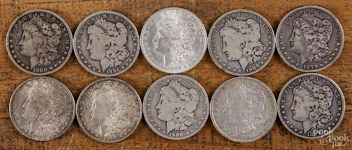 Ten Morgan silver dollars of various dates and grades, 1879-1900.