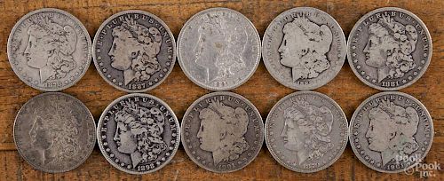 Ten Morgan silver dollars of various dates and grades, 1878-1901.