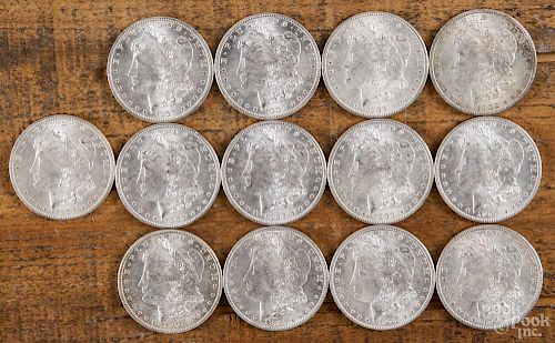 Thirteen Morgan silver dollars, 1902 O, uncirculated.