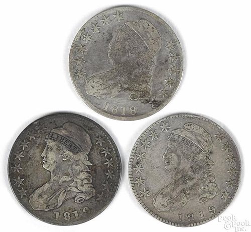 Three Cap Bust silver half dollars, to include an 1818, G-VG, and two 1819, G-VG.