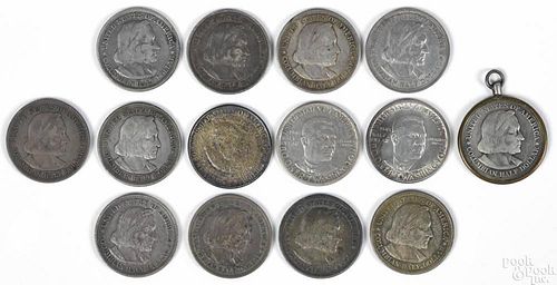 Fourteen commemorative half dollars, to include eleven Columbians, one having a bezel, two Booker T.