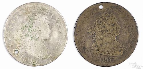 Two Draped Bust silver quarters, to include an 1806 and an 1807, both with holes and readable dates.