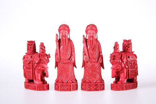FOUR 19TH CENTURY CHINESE RED STAINED IVORY CHESS PIECES, comprising a pair
