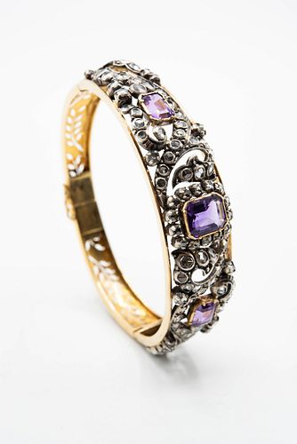 A MID 19TH CENTURY DIAMOND AND AMETHYST SET BANGLE, the pierced mount of sc