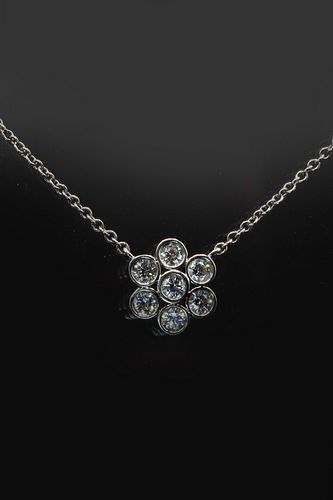 A DIAMOND AND PLATINUM NECKLACE BY TIFFANY & CO from the "Enchant" range, t