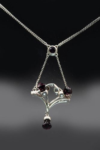 A SILVER AND AMETHYST PENDANT BY CHARLES HORNER, circa 1913, the mount of a