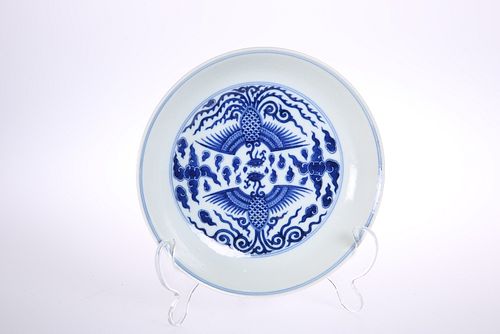 A CHINESE BLUE AND WHITE "DOUBLE PHOENIX" DISH, circular, painted to the we