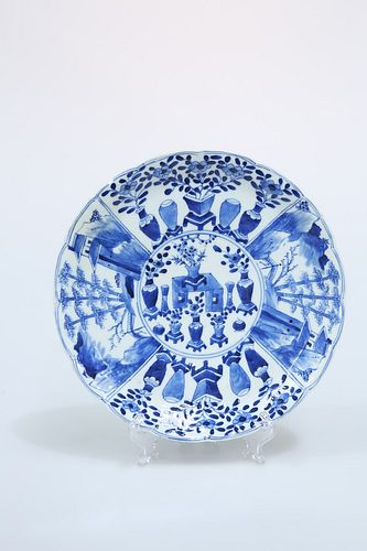 A CHINESE PORCELAIN BLUE AND WHITE PLATE, painted with vases and landscape 