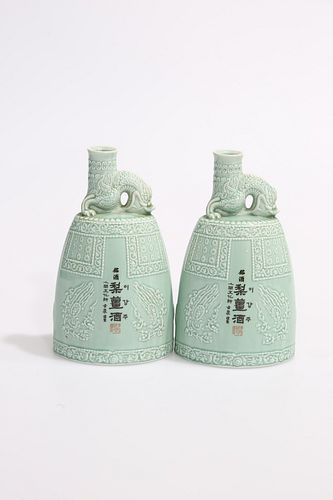 A PAIR OF CHINESE CELADON FLASK-FORM VASES, of tapering oval-section, the n