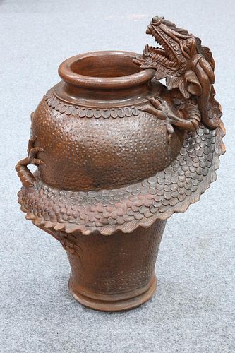 A LARGE  CHINESE TERRACOTTA FLOOR VASE MOULDED WITH A COILED DRAGON, of bal
