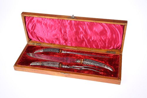 A LATE VICTORIAN OAK CASED THREE PIECE SILVER-MOUNTED STAG HORN HANDLED CAR