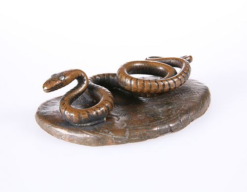 AN UNUSUAL PATINATED METAL MODEL OF A SNAKE, CIRCA 1900, modelled on a shap