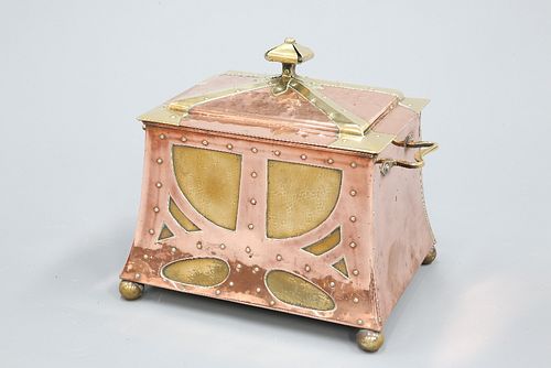 AN ARTS AND CRAFTS COPPER AND BRASS COAL BOX, the domed top with crown fini