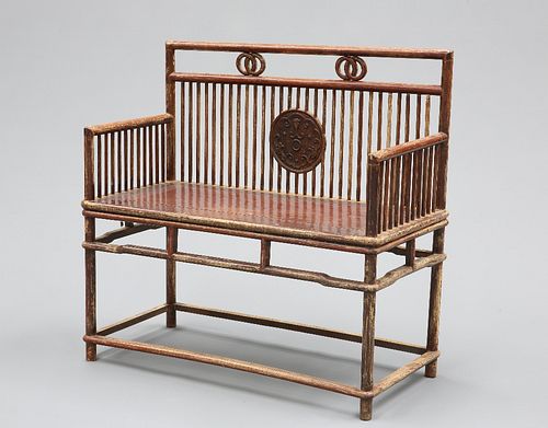A CHINESE BENCH, with spindle back centred by a roundel, the seat enclosed 