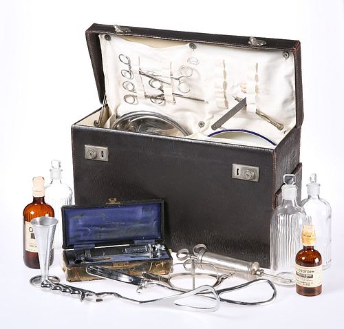 A 1950'S MEDICAL CASE, including an array of instruments and bottles. Case 
