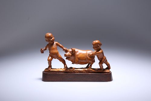 A JAPANESE CARVED WOODEN OKIMONO OF CHILDREN PLAYING WITH A PIG, Meiji peri